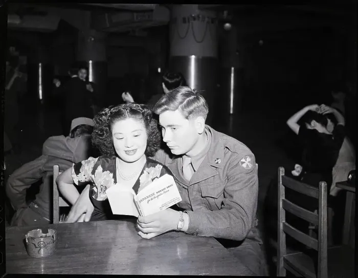 Framed Print : U.S. Private and Japanese Girl Look at Book