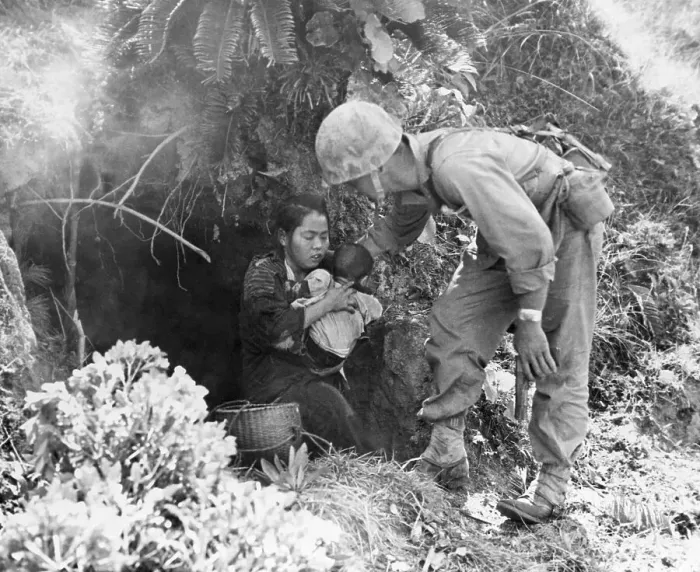 Framed Print : U.S. Soldier Helping Okinawan Civilians Framed Print : U.S. Soldier Helping Okinawan Civilians