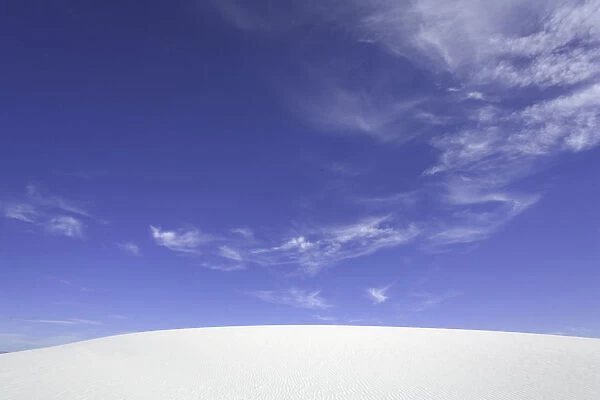 USA, New Mexico, White Sands National Monument, clouds over sand dune