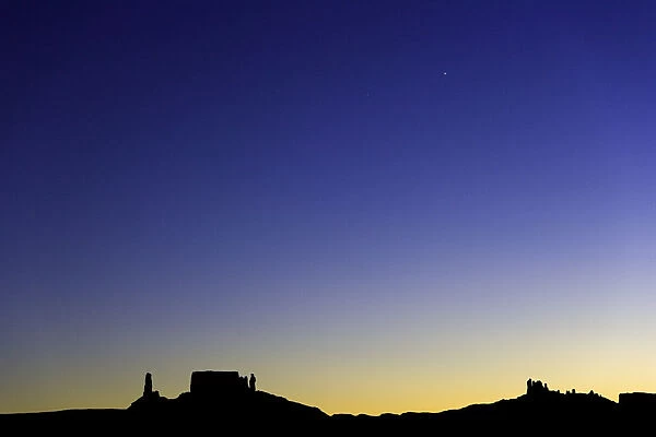 USA, Utah, Colorado Plateau, silhouettes of buttes and mesas at dusk
