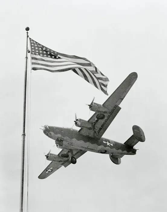 Framed Print : USAAF B-24 Liberator Bomber Flying Over US Flag Framed Print : USAAF B-24 Liberator Bomber Flying Over US Flag
