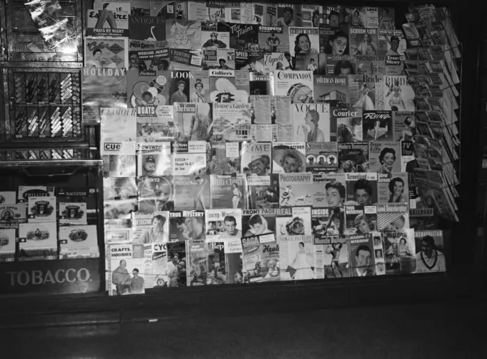 Framed Print : Variety of magazines in window display