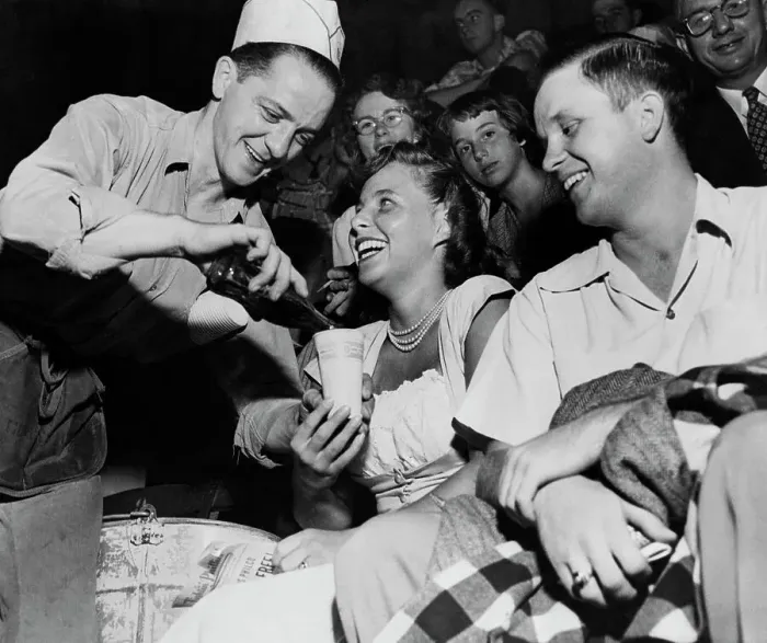 Framed Print : Vendor Pouring Soda for Couple at Baseball Game