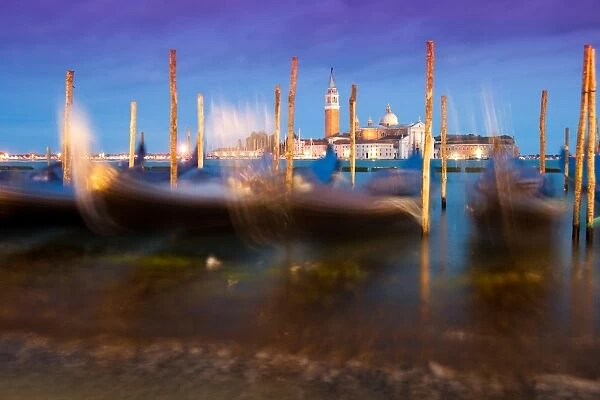Venice night view with gondolas in movement