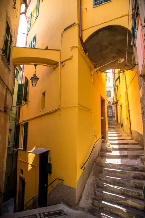 Framed Print : Vernazza narrow streets with stairs and yellow