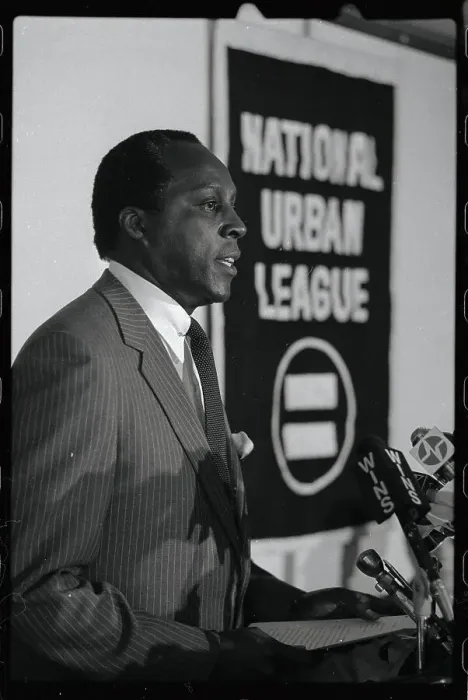 Framed Print : Vernon Jordan Standing by Banner Framed Print : Vernon Jordan Standing by Banner