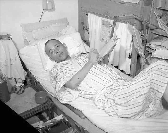 Framed Print : Victim of Radiation Disease Lying in Bed