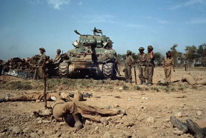 Framed Print : Victim of War With Soldiers and Tank in Background Framed Print : Victim of War With Soldiers and Tank in Background