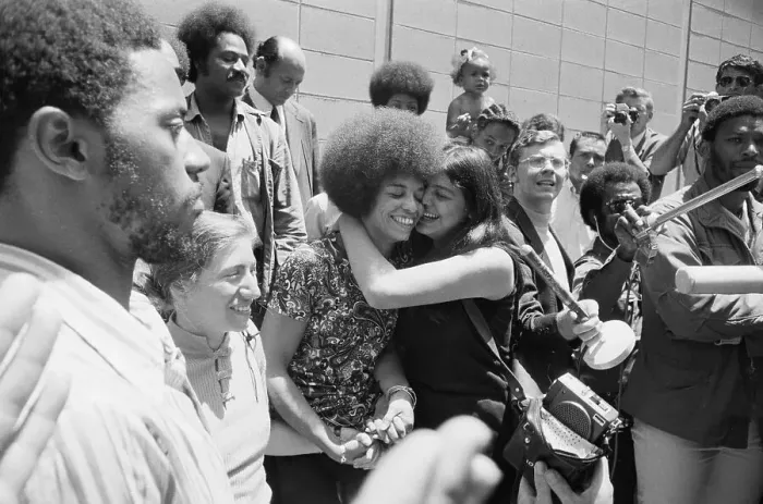 Framed Print : Victoia Machado Hugging Angela Davis Framed Print : Victoia Machado Hugging Angela Davis
