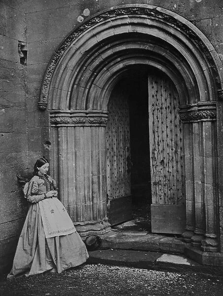 Victorian Lady. A woman outside an arched doorway, circa 1865