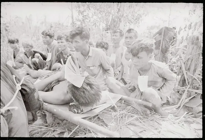 Framed Print : Viet Cong Captives Standing by Injured Framed Print : Viet Cong Captives Standing by Injured