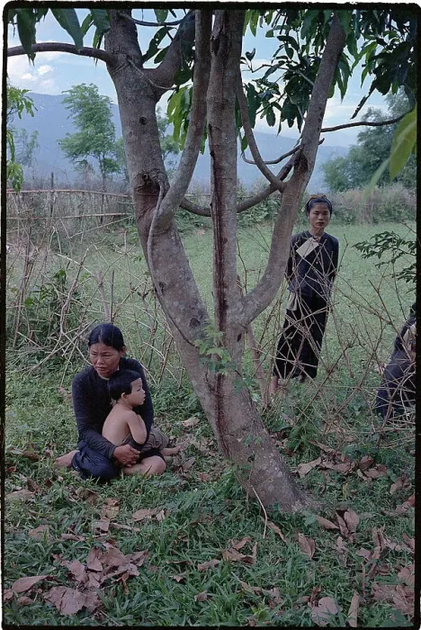 Framed Print : Viet Cong Supporter Seated with Her Baby