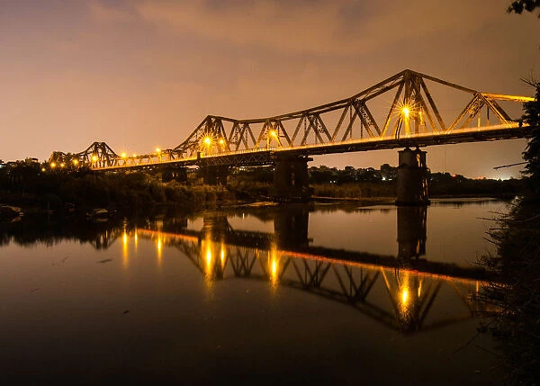 Vietnam - Reflections of Long Bien bridge on Song Hong river, Hanoi