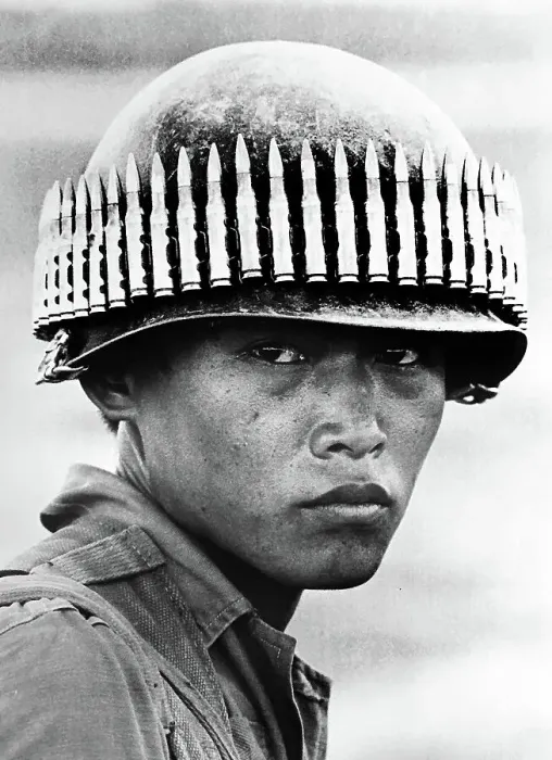 Framed Print : Vietnam Soldier with bullet-studded helmet Framed Print : Vietnam Soldier with bullet-studded helmet