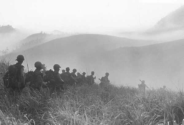 Vietnam War. A Photograph of US Soldiers Walking through Mist in the Cam-Lo Valley