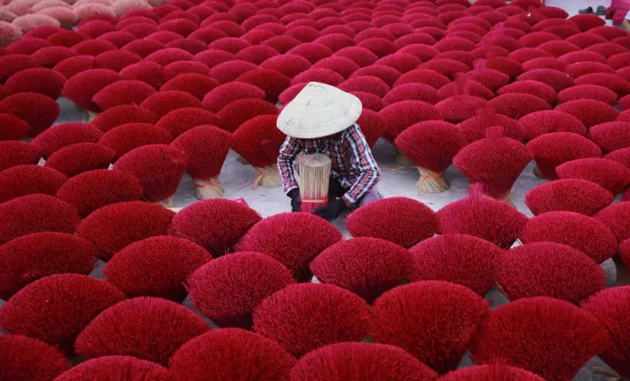 Framed Print : Vietnam - woman making red insense Framed Print : Vietnam - woman making red insense