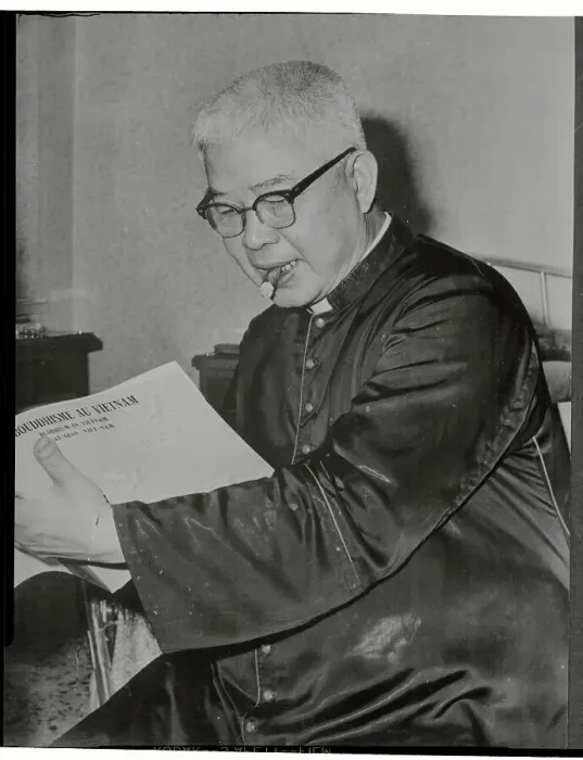 Framed Print : Vietnamese Archbishop Reading with Cigar in Mouth