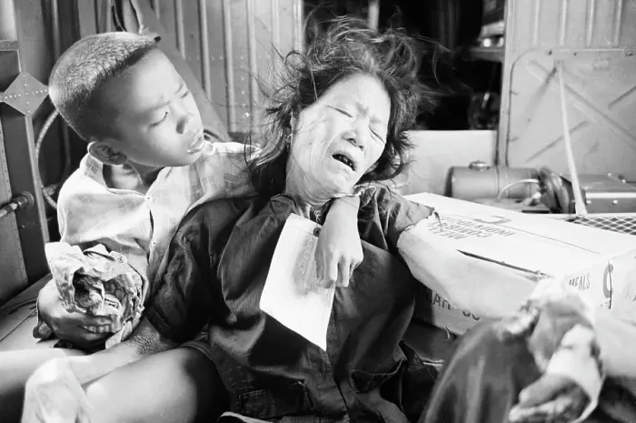 Framed Print : Vietnamese Boy Comforting Wounded Mother Framed Print : Vietnamese Boy Comforting Wounded Mother