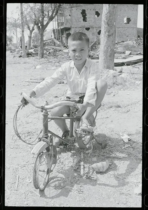 Framed Print : Vietnamese Boy on His Destroyed Bicycle