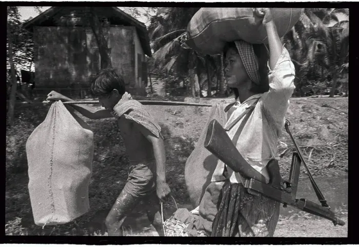 Framed Print : Vietnamese Family with Weapons of War Framed Print : Vietnamese Family with Weapons of War
