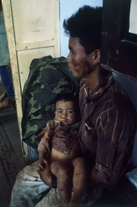 Framed Print : Vietnamese Father Holding His Child Framed Print : Vietnamese Father Holding His Child