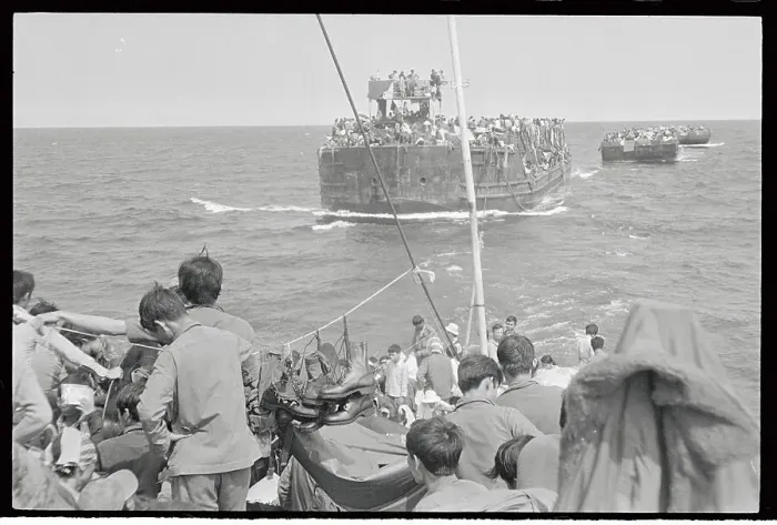 Framed Print : Vietnamese Refugees Being Towed Behind a Larger Ship Framed Print : Vietnamese Refugees Being Towed Behind a Larger Ship