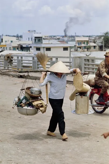 Framed Print : Vietnamese Woman Carrying Belongings Framed Print : Vietnamese Woman Carrying Belongings