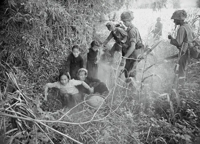 Framed Print : Vietnamese Woman and Children Emerging from Hole Framed Print : Vietnamese Woman and Children Emerging from Hole