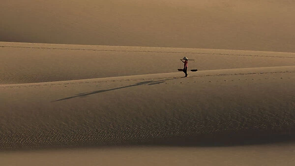 One Vietnamese woman on sand dune