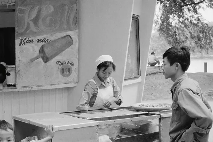 Framed Print : Vietnamese Woman Selling Ice Cream to Young Man Framed Print : Vietnamese Woman Selling Ice Cream to Young Man
