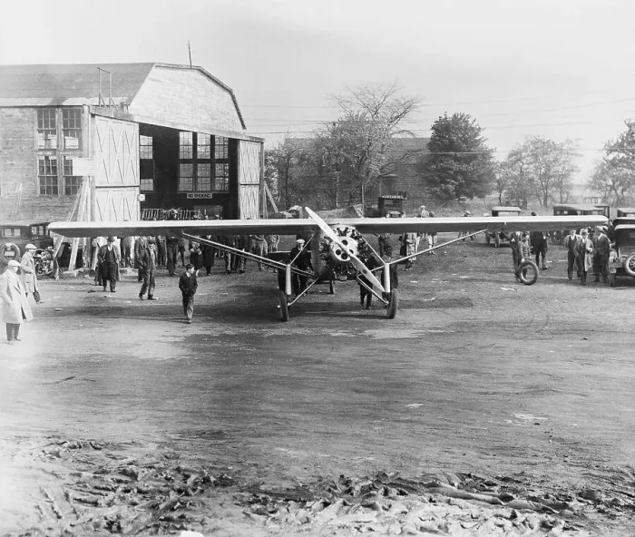 Framed Print : View of Airplane and Flight Staff on Field