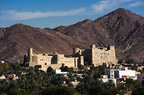 A view of Bahla Fort with the Hajar Mountains in the background. Northern Oman