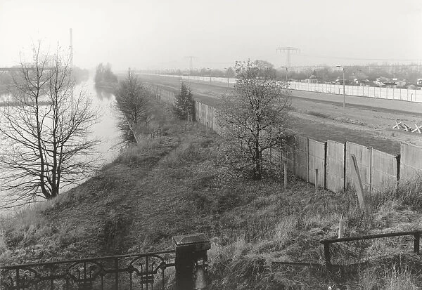 View over the Berlin Wall in 1985, panorama of the inner German border, known as the Death Strip, canal and fields in the autumn mist, Berlin, Germany, Europe