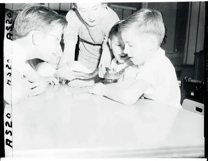 Framed Print : View of Children Handling Snake Framed Print : View of Children Handling Snake