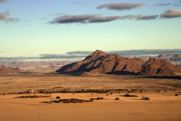 Framed Print : View from Elim Dune onto grass steppe, Sesriem Camp and Tsaris Mountains, Namib Desert Framed Print : View from Elim Dune onto grass steppe, Sesriem Camp and Tsaris Mountains, Namib Desert