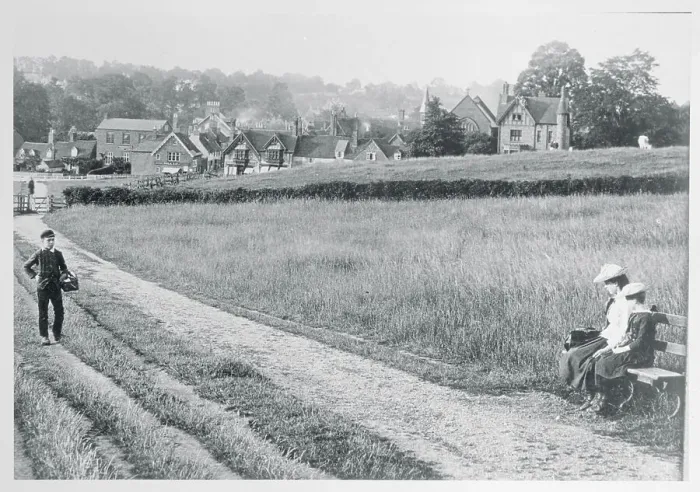 Framed Print : View of Field With Houses in Background Framed Print : View of Field With Houses in Background