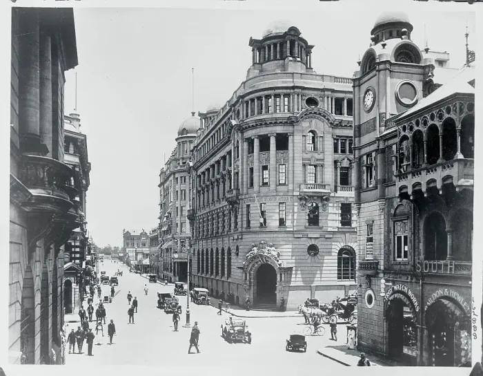 Framed Print : View of Large Buildings with Pedestrians Framed Print : View of Large Buildings with Pedestrians