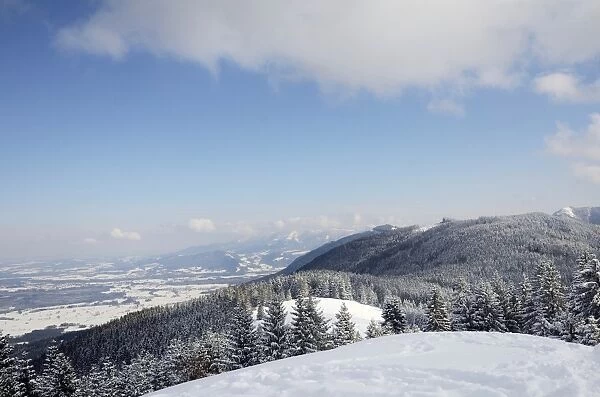 View from the peak of Mt Schwarzenberg to a snow-covered on snow-covered alpine upland and the Chiemgau Alps, Leitzachtal, bei Elbach, Upper Bavaria, Bavaria, Germany