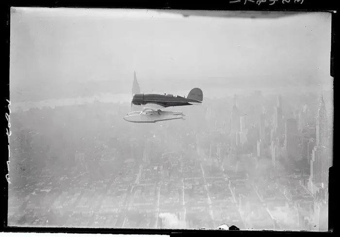 Framed Print : View of Plane Flying over New York City Framed Print : View of Plane Flying over New York City