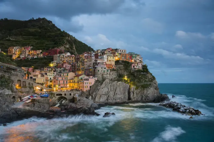 Framed Print : View of the town at dusk, Manarola, Cinque Terre, Liguria, Italy Framed Print : View of the town at dusk, Manarola, Cinque Terre, Liguria, Italy