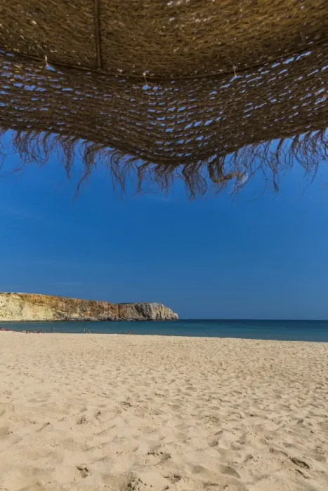 Framed Print : View from underneath a parasol out onto the beach, Praia da Mareta, Sagres, Algarve, Portugal, Europe Framed Print : View from underneath a parasol out onto the beach, Praia da Mareta, Sagres, Algarve, Portugal, Europe