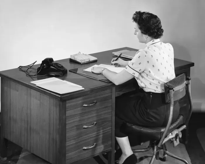 Framed Print : Back view of woman writing and looking at phone Framed Print : Back view of woman writing and looking at phone