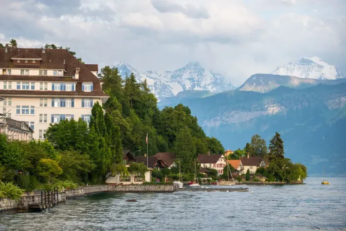 Framed Print : The village and landscape beside lake Thun, Switzer Framed Print : The village and landscape beside lake Thun, Switzer