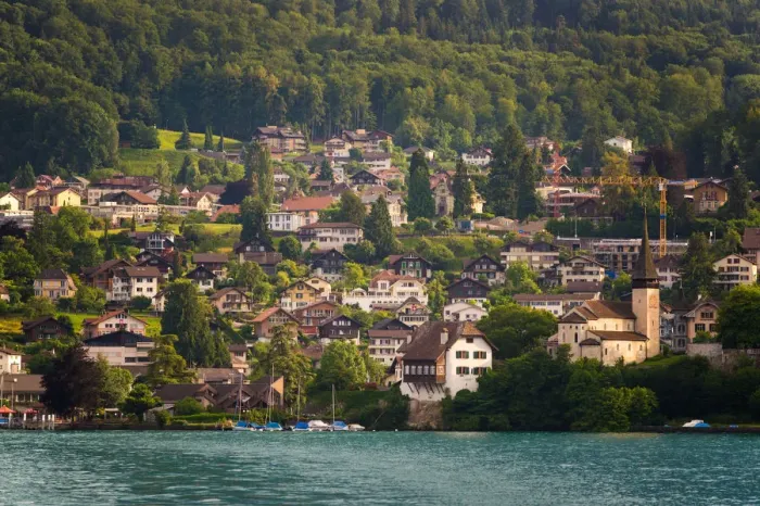 Framed Print : The village and landscape beside lake Thun, Switzer