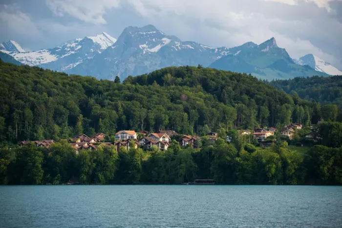 Framed Print : The village and landscape beside lake Thun, Switzer
