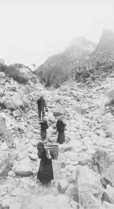 Framed Print : Villagers Carrying Water over Hilly Terrain