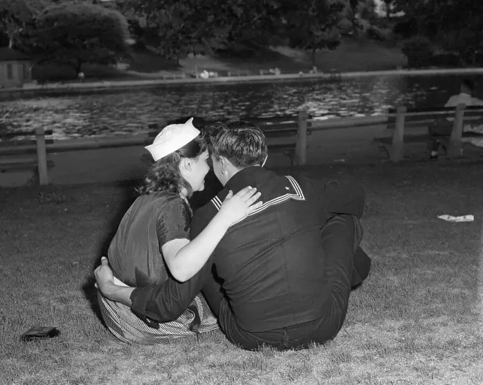Framed Print : Vintage photograph of sailor and his girlfriend sitting together on grass Framed Print : Vintage photograph of sailor and his girlfriend sitting together on grass