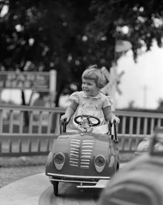 Framed Print : Vintage photograph showing girl (4-5) riding in carousel Framed Print : Vintage photograph showing girl (4-5) riding in carousel