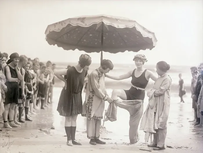 Framed Print : Vintage photograph showing young woman undressing on beach Framed Print : Vintage photograph showing young woman undressing on beach