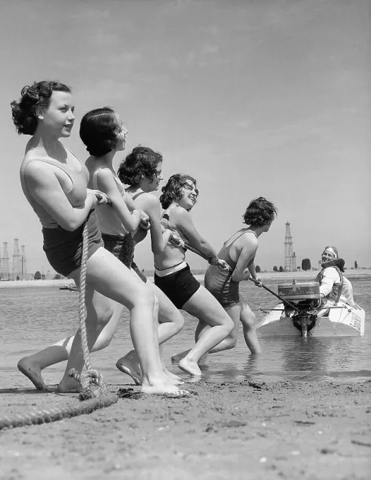 Framed Print : Vintage photograph showing young women playing tug of war with motorboat Framed Print : Vintage photograph showing young women playing tug of war with motorboat